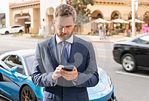 car rent dealer chatting on phone outdoor