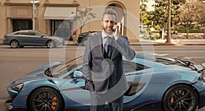 car rent dealer speaking on phone outdoor