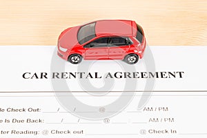 Car Rental Agreement With Red Car on Center