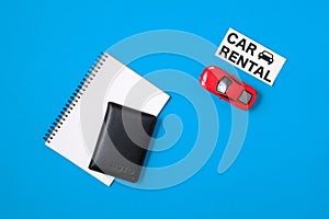 Car rental concept. Composition with driver`s license, blank paper, toy car, text sign