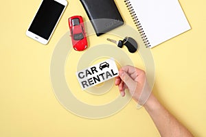 Car rental concept. Human hand holding text sign