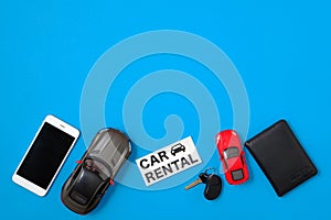 Car rental service web banner template. Composition with smartphone, toy cars, vehicle key, driver`s license and text sign