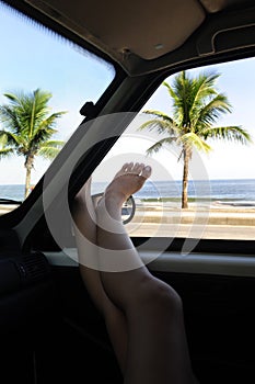 Car rental: woman relaxing in car