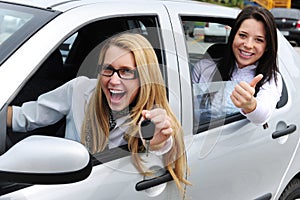 Car rental: women driving a car