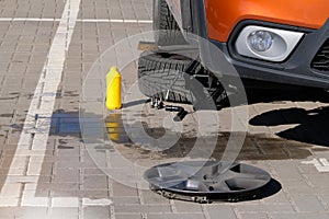 Car repair concept. Technicians are changing tires. Wheel balancing or repair and change car tire. Sunlight