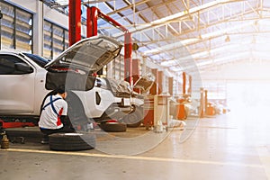 car repair in garage service station with soft-focus and over light in the background