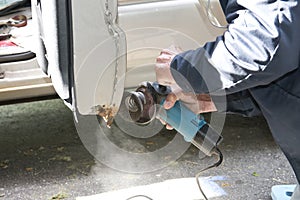 Car Repair Grinding to Remove Rust photo