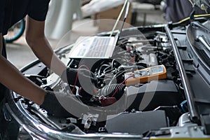Car repair and maintenance. Performing engine diagnostics photo