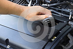 Car repair service, Auto mechanic checking oil level in a engine