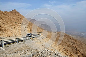 Car on the road in Judean desert near Dead Sea,Israel,MidEast photo