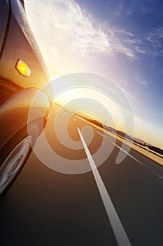 Car on road with motion blur background.