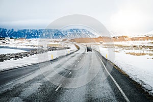 Car on the road or street or road trip surrounding by snow with