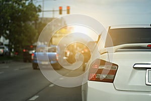 car on the road with traffic lights red