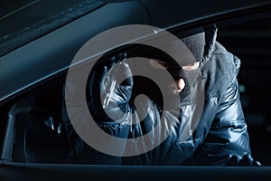 Car robber at night