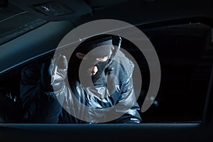 Car robber at night