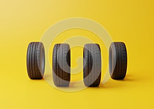 Car rubber tyres on a yellow background