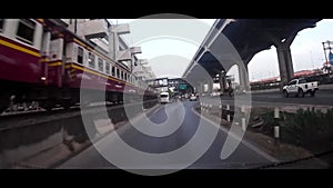 The car run in the opposite direction with the Thai railway   transportation.