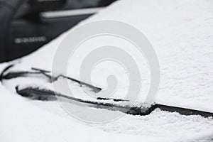 A car on a rural road in the first autumn snow. The first winter