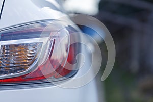 Car`s exterior details.Element of design.Rear light. Rear light of a modern white car