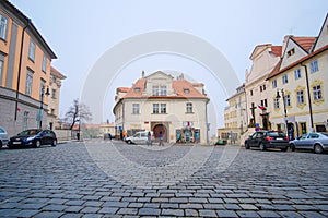 Car`s parking on a street in the historical part of Prague