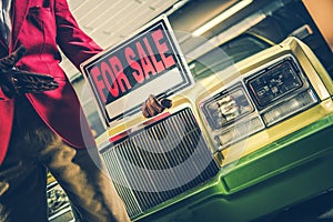 Car For Sale Sign in a Hand