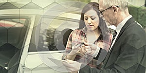 Car salesman giving explanations on tablet to young woman, light effect, geometric pattern