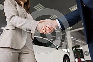 Car Salesman Shaking Hands with Client