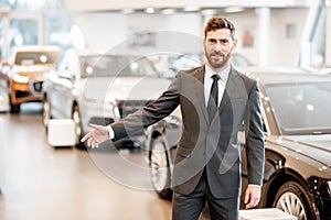 Car salesman in the showroom