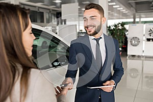 Car Salesman Working with Client