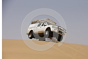 A car on sand dune, Africa