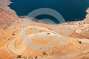 Car on the sand road at Fjord Khor Najd in Oman