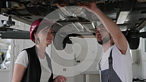 Car service, Professional maintenance people concept, car`s service worker Advised client, helps feminine customer on