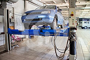 Car service station on the lift.