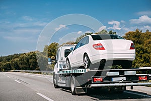 Car Service Transportation Concept. Tow Truck Transporting Car Or Help On Road Transports Wrecker Broken Car. Auto
