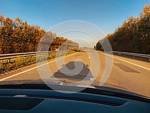 Car shadow on asphalt on German autobahn