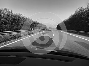 Car shadow on German autobahn black and white