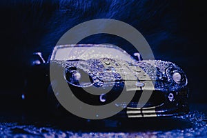 Car Shot in rain darkness sports car lightning style aesthetic blue white stripes wet surface image shot