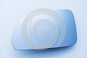 Car side view mirror on clean blue background