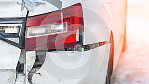 A car with a smashed rear end