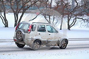 Car on a snow-covered road after high snow-storm in Moscow