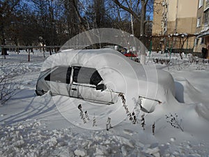 Car in the snow drifts