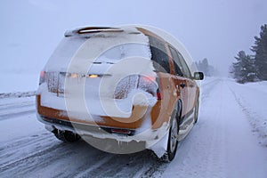 Car with snow on winter road