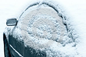 Car during a snowfall in town