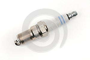 Car spark plug on isolated white background