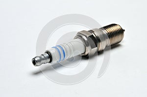 Car spark plug on isolated white background