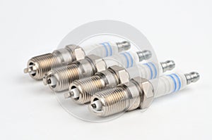 Car spark plug on isolated white background