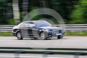 Luxury Mercedes-Benz speeding on empty highway