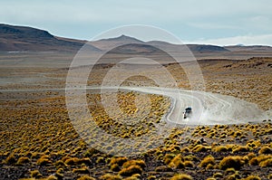 Car speeding in the desert of Bolivia