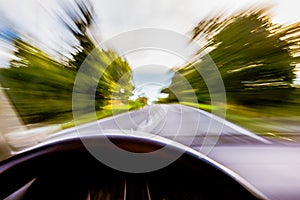 Car Speeding on Road Blurred
