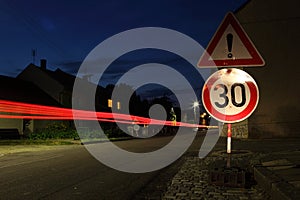 Car speeding through a speed limit zone